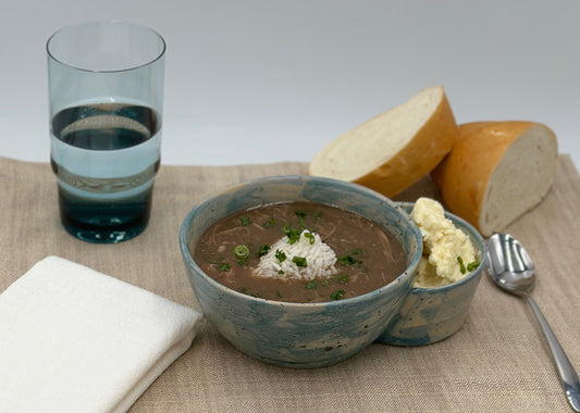 One Gumbo bowl with potato salad bowl attached
